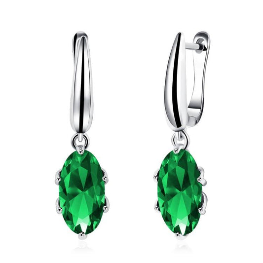 Emerald Oval Cut Earrings Set in 18K White Gold